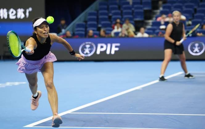 (251003) -- BEIJING, Oct. 3, 2025 -- Hsieh Su-Wei (L) Jelena Ostapenko compete during the women s doubles quarterfinal match between Hsieh Su-Wei (Chinese Taipei) Jelena Ostapenko (Latvia) and Tereza Mihalikova (Slovakia) Olivia Nicholls (Britain) at 2025 China Open tennis tournament in Beijing, China, Oct. 3, 2025. (Photo by Xinhua) (SP)CHINA-BEIJING-TENNIS-CHINA OPEN-WOMEN S DOUBLES-QUARTERFINAL (CN) MaxZihan 