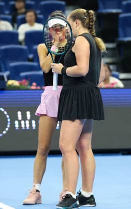 (251003) -- BEIJING, Oct. 3, 2025 -- Hsieh Su-Wei (L) Jelena Ostapenko react during the women s doubles quarterfinal match between Hsieh Su-Wei (Chinese Taipei) Jelena Ostapenko (Latvia) and Tereza Mihalikova (Slovakia) Olivia Nicholls (Britain) at 2025 China Open tennis tournament in Beijing, China, Oct. 3, 2025. (Photo by Xinhua) (SP)CHINA-BEIJING-TENNIS-CHINA OPEN-WOMEN S DOUBLES-QUARTERFINAL (CN) MaxZihan 