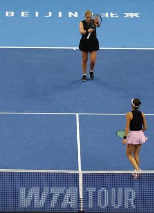 (251003) -- BEIJING, Oct. 3, 2025 -- Hsieh Su-Wei (R) Jelena Ostapenko react during the women s doubles quarterfinal match between Hsieh Su-Wei (Chinese Taipei) Jelena Ostapenko (Latvia) and Tereza Mihalikova (Slovakia) Olivia Nicholls (Britain) at 2025 China Open tennis tournament in Beijing, China, Oct. 3, 2025. (Photo by Xinhua) (SP)CHINA-BEIJING-TENNIS-CHINA OPEN-WOMEN S DOUBLES-QUARTERFINAL (CN) MaxZihan 