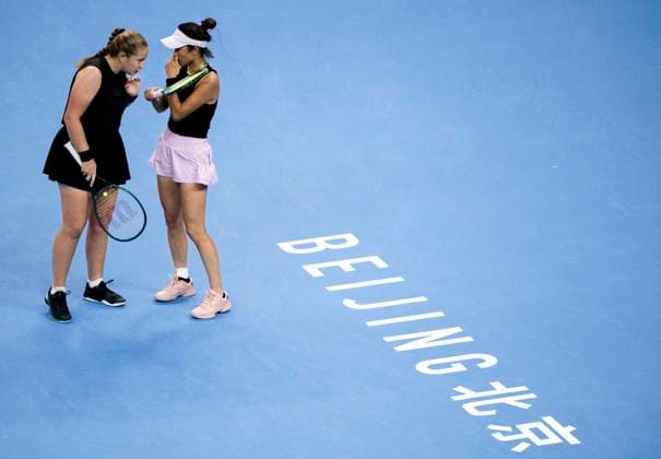(251003) -- BEIJING, Oct. 3, 2025 -- Hsieh Su-Wei (R) Jelena Ostapenko react during the women s doubles quarterfinal match between Hsieh Su-Wei (Chinese Taipei) Jelena Ostapenko (Latvia) and Tereza Mihalikova (Slovakia) Olivia Nicholls (Britain) at 2025 China Open tennis tournament in Beijing, China, Oct. 3, 2025. ) (SP)CHINA-BEIJING-TENNIS-CHINA OPEN-WOMEN S DOUBLES-QUARTERFINAL (CN) HuxJingwen 