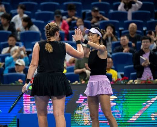 (251003) -- BEIJING, Oct. 3, 2025 -- Hsieh Su-Wei (R) Jelena Ostapenko celebrate after the women s doubles quarterfinal match between Hsieh Su-Wei (Chinese Taipei) Jelena Ostapenko (Latvia) and Tereza Mihalikova (Slovakia) Olivia Nicholls (Britain) at 2025 China Open tennis tournament in Beijing, China, Oct. 3, 2025. ) (SP)CHINA-BEIJING-TENNIS-CHINA OPEN-WOMEN S DOUBLES-QUARTERFINAL (CN) HuxJingwen 