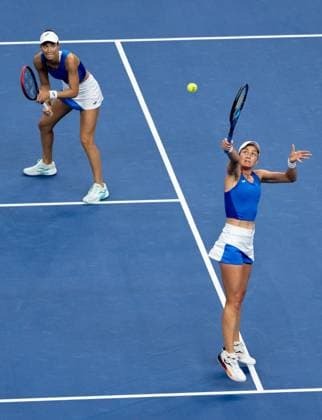 (251003) -- BEIJING, Oct. 3, 2025 -- Tereza Mihalikova (L) Olivia Nicholls compete during the women s doubles quarterfinal match between Hsieh Su-Wei (Chinese Taipei) Jelena Ostapenko (Latvia) and Tereza Mihalikova (Slovakia) Olivia Nicholls (Britain) at 2025 China Open tennis tournament in Beijing, China, Oct. 3, 2025. ) (SP)CHINA-BEIJING-TENNIS-CHINA OPEN-WOMEN S DOUBLES-QUARTERFINAL (CN) HuxJingwen 