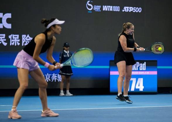 (251003) -- BEIJING, Oct. 3, 2025 -- Hsieh Su-Wei Jelena Ostapenko (R) compete during the women s doubles quarterfinal match between Hsieh Su-Wei (Chinese Taipei) Jelena Ostapenko (Latvia) and Tereza Mihalikova (Slovakia) Olivia Nicholls (Britain) at 2025 China Open tennis tournament in Beijing, China, Oct. 3, 2025. ) (SP)CHINA-BEIJING-TENNIS-CHINA OPEN-WOMEN S DOUBLES-QUARTERFINAL (CN) HuxJingwen 