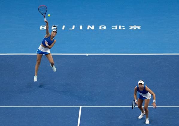 (251003) -- BEIJING, Oct. 3, 2025 -- Tereza Mihalikova (L) Olivia Nicholls compete during the women s doubles quarterfinal match between Hsieh Su-Wei (Chinese Taipei) Jelena Ostapenko (Latvia) and Tereza Mihalikova (Slovakia) Olivia Nicholls (Britain) at 2025 China Open tennis tournament in Beijing, China, Oct. 3, 2025. ) (SP)CHINA-BEIJING-TENNIS-CHINA OPEN-WOMEN S DOUBLES-QUARTERFINAL (CN) HuxJingwen 