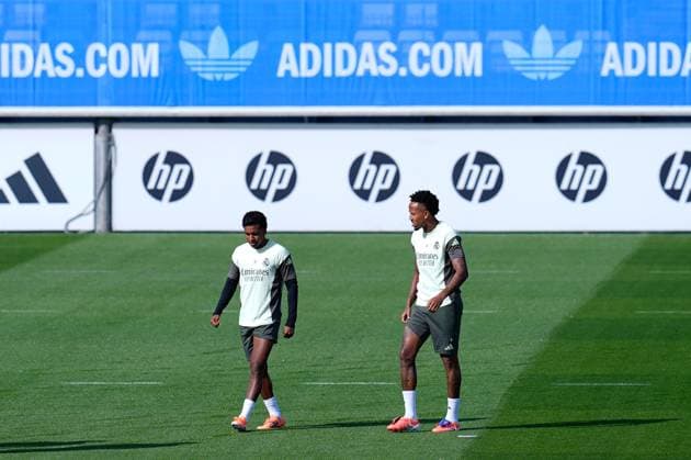 October 3, 2025, Valdebebas, Madrid, Spain: Eder Militao of Real Madrid CF talk to Rodrygo of Real Madrid CF during the training day of Real Madrid ahead the Spanish League, LaLiga EA Sports, football match against Villarreal CF at Ciudad Deportiva Real Madrid on October 03, 2025, in Valdebebas, Madrid, Spain. Valdebebas Spain - ZUMAa181 20251003_zaa_a181_023 Copyright: xDennisxAgyemanx