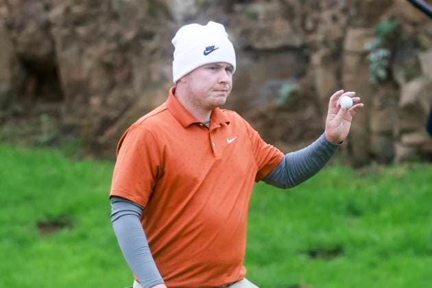 3rd October 2025; Kingsbarns Golf Links, St Andrews, Fife, Scotland; Alfred Dunhill Links Golf Championship, Round Two; Robert Macintyre of Scotland acknowledges the applause after holing a birdie putt on the twelfth green at Kingsbarns Golf Links during the second round of the Alfred Dunhill Links Championship  DavidxYoung