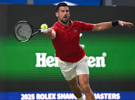 (251003) -- SHANGHAI, Oct. 3, 2025 -- Novak Djokovic hits a return during the men s singles round of 64 match between Novak Djokovic of Serbia and Borna Coric of Croatia at the ATP, Tennis Herren World Tour Shanghai Masters tennis tournament in Shanghai, east China, Oct. 3, 2025. ) (SP)CHINA-SHANGHAI-TENNIS-ATP TOUR-SHANGHAI MASTERS-MEN S SINGLES (CN) ChenxHaoming 