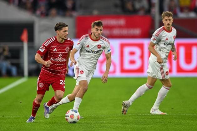 03 10 2025, Soccer 2 Bundesliga, Season 2025 2026, Matchday 08, Fortuna Duesseldorf 1 FC Nuernberg in the Merkur Spiel Arena in Duesseldorf duel between Florent Muslija Fortuna Duesseldorf, 24 and Adam Markhiyev 1 FC Nuernberg, 06 Important note In accordance with the regulations of the DFL German Football League and the DFB German Football Association, it is prohibited to utilize or have utilized photographs taken in the stadium or of the match in the form of sequential images or video-like photo series Foto Kirchner Media Thomas Haesler Copyright: xKirchner-Media ThomasxHaeslerx