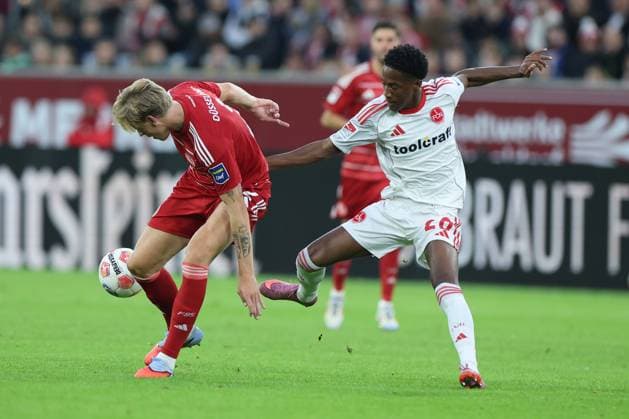 GER, 2 FBL Fortuna Duesseldorf vs 1 FC Nuernberg 03 10 2025, Merkur Spiel Arena, Duesseldorf, GER, 2 FBL Fortuna Duesseldorf vs 1 FC Nuernberg, in the picture Jesper Daland Duesseldorf 2 , in a duel against Papa Demba Diop 1 FC Nuernberg 20 , nordphotoxGmbHx xMeuter nph00351