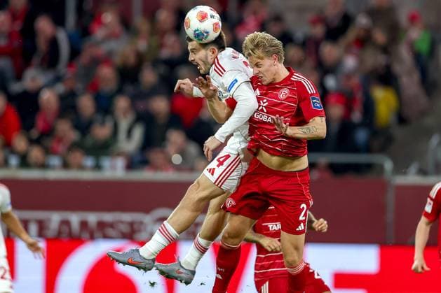 03 10 2025, Football, Fortuna Düsseldorf 1 FC Nürnberg, 2 Fußball Bundesliga, Merkur Spiel Arena, Saison 2025 2026 Luka Lochoshvili 1FC Nuernberg 24 in duel against Jesper Daland Fortuna Düsseldorf 02 Kopfball Kopfballduell Strafraum Strafraumaktion DFB regulations prohibit any use of photographs as image sequences and or quasi video Nordrhein Westfalen Germany