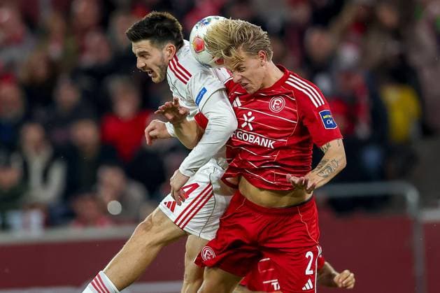 03 10 2025, Football, Fortuna Düsseldorf 1 FC Nürnberg, 2 Fußball Bundesliga, Merkur Spiel Arena, Saison 2025 2026 Luka Lochoshvili 1FC Nuernberg 24 in duel against Jesper Daland Fortuna Düsseldorf 02 Kopfball Kopfballduell Strafraum Strafraumaktion DFB regulations prohibit any use of photographs as image sequences and or quasi video Nordrhein Westfalen Germany