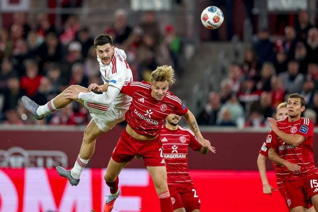 03 10 2025, Football, Fortuna Düsseldorf 1 FC Nürnberg, 2 Fußball Bundesliga, Merkur Spiel Arena, Saison 2025 2026 Luka Lochoshvili 1FC Nuernberg 24 in duel against Jesper Daland Fortuna Düsseldorf 02 Kopfball Kopfballduell Strafraum Strafraumaktion DFB regulations prohibit any use of photographs as image sequences and or quasi video Nordrhein Westfalen Germany