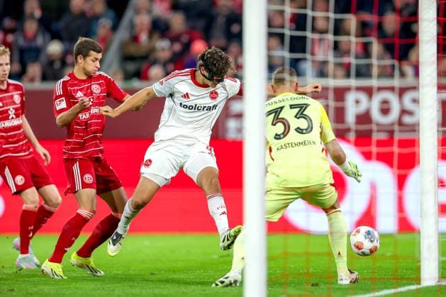 03 10 2025, Football, Fortuna Düsseldorf 1 FC Nürnberg, 2 Fußball Bundesliga, Merkur Spiel Arena, Saison 2025 2026 Fabio Gruber 1FC Nuernberg 04 shooting at the goal of goalkeeper Florian Kastenmeier Fortuna Düsseldorf 33 penalty area action DFB regulations prohibit any use of photographs as image sequences and or quasi video Nordrhein Westfalen Germany