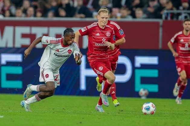 GER, 2 FBL Fortuna Duesseldorf vs 1 FC Nuernberg 03 10 2025, Merkur Spiel Arena, Duesseldorf, GER, 2 FBL Fortuna Duesseldorf vs 1 FC Nuernberg, in the picture Mohamed Alë Zoma 1 FC Nuernberg 23 , Tim Breithaupt Fortuna Duesseldorf 6 , nordphotoxGmbHx xMeuter nph00351