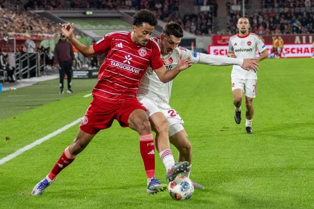 03 10 2025, Soccer 2 Bundesliga, Season 2025 2026, Matchday 08, Fortuna Duesseldorf 1 FC Nuernberg in the Merkur Spiel Arena in Duesseldorf duel between Emmanuel Iyoha Fortuna Duesseldorf, 19 and Luka Lokoshvili 1 FC Nuernberg, 24 Important note In accordance with the regulations of the DFL German Football League and the DFB German Football Association, it is prohibited to utilize or have utilized photographs taken in the stadium and or of the match in the form of sequential images and or video-like photo series Foto Kirchner Media Thomas Haesler Copyright: xKirchner-Media ThomasxHaeslerx