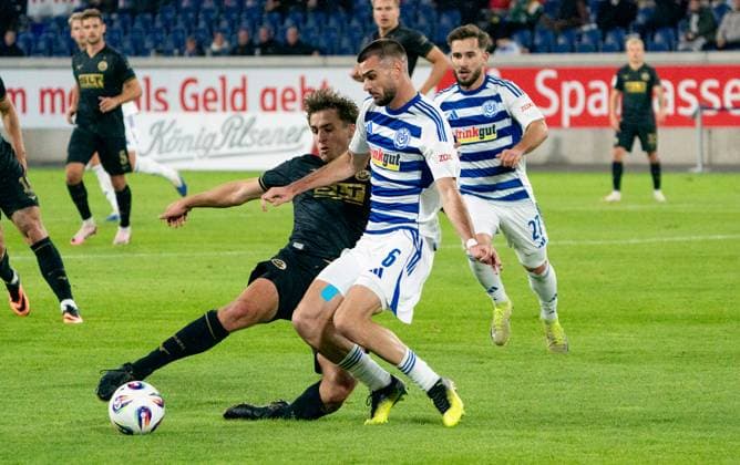 3 10 2025, Soccer, GER, Men, 3 Liga, DFL, Matchday 10, Season 2025 26, MSV Duisburg FC Hansa Rostock Benno Dietze FC Hansa Rostock, left against Rasim Bulic MSV Duisburg, 2 v left Duisburg Schauinsland Reisen Arena Nordrhein Westfaklen Germany