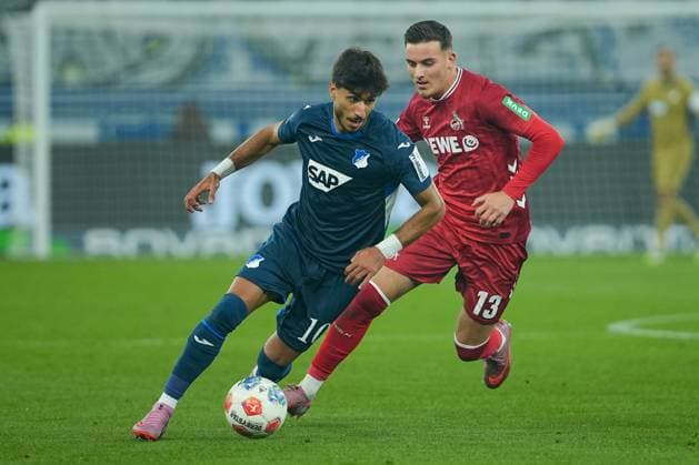Soccer Bundesliga, Matchday 6, TSG Hoffenheim 1 FC Köln on 03 10 2025 in Sinsheim PreZero Arena , Germany, Season 2025 2026 DFL REGULATIONS PROHIBIT ANY USE OF PHOTOGRAPHS AS IMAGE SEQUENCES AND OR QUASI VIDEO Muhammed Damar 10, TSG on the ball against Said El Mala 13, KOE Sinsheim PreZero Arena Germany Copyright: xChristophxKinzingerx