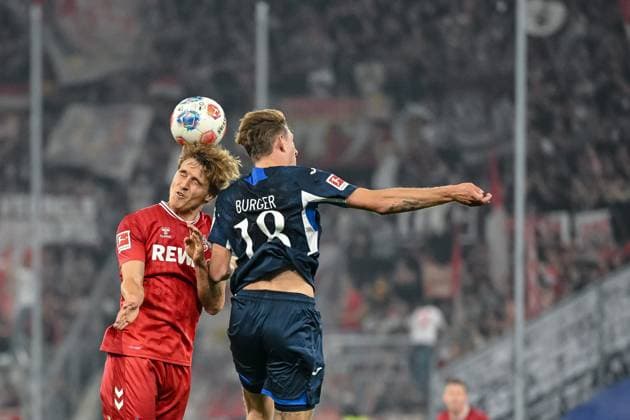 Timo Hübers (1. FC Köln) und Wouter Burger (1899 Hoffenheim) im Zweikampf waehrend des spiels der Bundesliga zwischen TSG Hoffenheim und 1. FC Köln, PreZero Arena am 03. October 2025 in Sinsheim, Deutschland. (Foto von Harry Langer DeFodi Images) +++ Timo Hübers (1. FC Köln) und Wouter Burger (1899 Hoffenheim) battle for the ball during the Bundesliga match between TSG Hoffenheim and 1. FC Köln at PreZero Arena on October 3, 2025 in Sinsheim, Germany. (Photo by Harry Langer DeFodi Images) DFL regulations prohibit any use of photographs as image sequences and or quasi-video. (Photo by Harry Langer DeFodi Images) DFL regulations prohibit any use of photographs as image sequences and or quasi-video. Timo Hübers 1 FC Köln and Wouter Burger 1899 Hoffenheim in a duel during the Bundesliga match between TSG Hoffenheim and 1 FC Köln, PreZero Arena on 03 October 2025 in Sinsheim, Germany Photo by Harry Langer DeFodi Images Timo Hübers 1 FC Köln and Wouter Burger 1899 Hoffenheim battle for the ball during the Bundesliga match between TSG Hoffenheim and 1 FC Köln at PreZero Arena on October 3, 2025 in Sinsheim, Germany Photo by Harry Langer DeFodi Images DFL regulations prohibit any use of photographs as image sequences and or quasi video Photo by Harry Langer DeFodi Images DFL regulations prohibit any use of photographs as image sequences and or quasi video