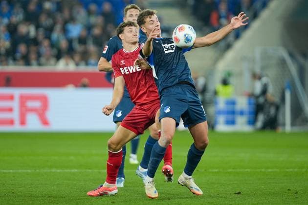 Soccer Bundesliga, Matchday 6, TSG Hoffenheim 1 FC Köln on 03 10 2025 in Sinsheim PreZero Arena , Germany, Season 2025 2026 DFL REGULATIONS PROHIBIT ANY USE OF PHOTOGRAPHS AS IMAGE SEQUENCES AND OR QUASI VIDEO Fisnik Asllani 11, TSG in duel with Eric Martel 6, KOE Sinsheim PreZero Arena Germany Copyright: xChristophxKinzingerx