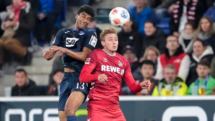 from left Bernardo Fernandes da Silva Junior Hoffenheim, 13 , Sebastian Sebulonsen Cologne, 28 , header, header duel, game scene, duel in the air, action, action, 03 10 2025, Sinsheim Germany , Football, Bundesliga, TSG 1899 Hoffenheim 1 FC Köln, DFB DFL REGULATIONS PROHIBIT ANY USE OF PHOTOGRAPHS AS IMAGE SEQUENCES AND OR QUASI VIDEO xozx