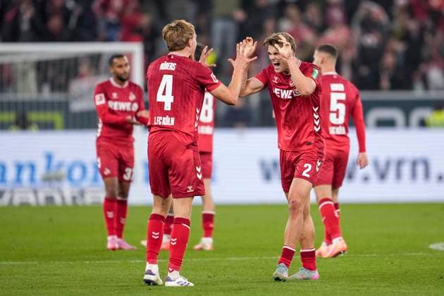 from left Timo Bernd Hübers Cologne, 4 , Joel Schmied Cologne, 2 , player of 1 FC Cologne, cheering after the final whistle, joy about the victory, winner, winner, cheers, cheering, cheerful, positive, happy, rejoice, optimistic, Highlight, Action, Action, 03 10 2025, Sinsheim Germany , Soccer, Bundesliga, TSG 1899 Hoffenheim 1 FC Köln, DFB DFL REGULATIONS PROHIBIT ANY USE OF PHOTOGRAPHS AS IMAGE SEQUENCES AND OR QUASI VIDEO xozx