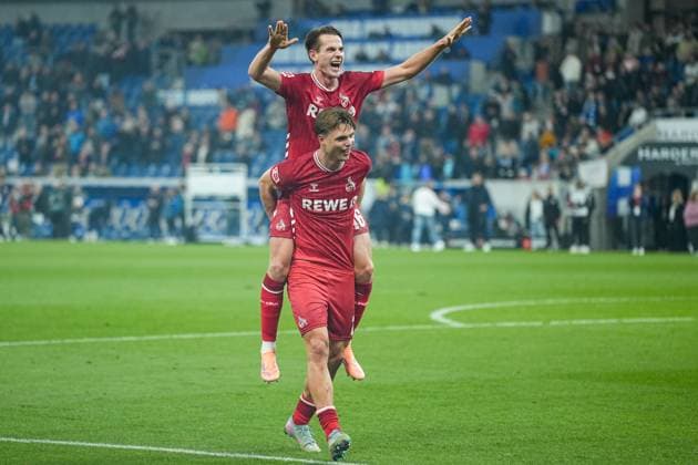 Soccer Bundesliga, Matchday 6, TSG Hoffenheim 1 FC Köln on 03 10 2025 in Sinsheim PreZero Arena , Germany, Season 2025 2026 DFL REGULATIONS PROHIBIT ANY USE OF PHOTOGRAPHS AS IMAGE SEQUENCES AND OR QUASI VIDEO Joel Schmied 2, KOE and Jakub Kaminski 16, KOE on the way to the fans Sinsheim PreZero Arena Germany Copyright: xChristophxKinzingerx