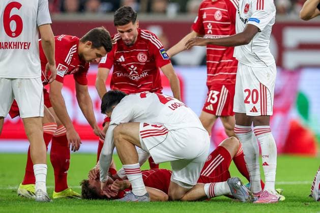 03 10 2025, Football, Fortuna Düsseldorf 1 FC Nürnberg, 2 Fußball Bundesliga, Merkur Spiel Arena, Saison 2025 2026 Moritz Heyer Fortuna Düsseldorf 05 lies on the pitch in pain and requires medical attention DFB regulations prohibit any use of photographs as image sequences and or quasi video Nordrhein Westfalen Germany