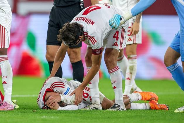 03 10 2025, Football, Fortuna Düsseldorf 1 FC Nürnberg, 2 Fußball Bundesliga, Merkur Spiel Arena, Saison 2025 2026 Rafael Lubach 1FC Nuernberg 18 lies on the pitch in pain and needs medical attention DFB regulations prohibit any use of photographs as image sequences and or quasi video Nordrhein Westfalen Germany
