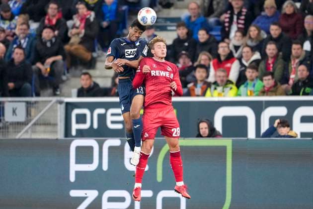 from left Bernardo Fernandes da Silva Junior Hoffenheim, 13 , Sebastian Sebulonsen Cologne, 28 , header, header duel, game scene, duel in the air, action, action, 03 10 2025, Sinsheim Germany , Football, Bundesliga, TSG 1899 Hoffenheim 1 FC Köln, DFB DFL REGULATIONS PROHIBIT ANY USE OF PHOTOGRAPHS AS IMAGE SEQUENCES AND OR QUASI VIDEO xozx