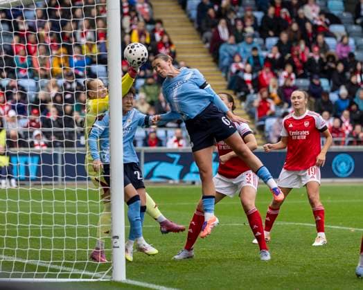 4th October 2025; Joie Stadium, Manchester, England; Womens Super League Football, Manchester City versus Arsenal; Goalkeeper Daphne van Domselaar of Arsenal Women makes a save from the header from Grace Clinton of Manchester City Women  TimxWilliams