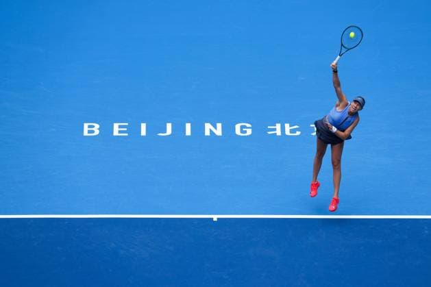 (251004) -- BEIJING, Oct. 4, 2025 -- Amanda Anisimova serves during the women s singles semifinal match between Coco Gauff of the United States and Amanda Anisimova of the United States at 2025 China Open tennis tournament in Beijing, China, Oct. 4, 2025. ) (SP)CHINA-BEIJING-TENNIS-CHINA OPEN-WOMEN S SINGLES-SEMIFINAL (CN) NaxYuqi 