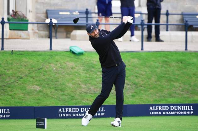 4th October 2025; The Old Course at St Andrews, Fife, Scotland; Alfred Dunhill Links Golf Championship, Round Three; Dustin Johnson of USA plays a shot from the tee on the first hole at the Old Course, St Andrews during the third round at the Alfred Dunhill Links Championship  DavidxYoung