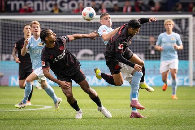 DFL Bayer 04 Leverkusen 1 FC Union Berlin, 04 10 2025 Loic Bade Bayer 04 Leverkusen, 5 , Andrej Ilic 1 FC Union Berlin, 23 , in the air Ezequiel Fernandez Bayer 04 Leverkusen, 6 Bayer 04 Leverkusen 1 FC Union Berlin on matchday 6 of the 1 Bundesliga on 04 10 2025 at the BayArena in Leverkusen THE DFL REGULATIONS PROHIBIT ANY USE OF PHOTOS AS PICTURE SEQUENCES AND OR QUASI VIDEO Bayer 04 Leverkusen 1 FC Union Berlin on Matchday 6 of the 1 Bundesliga on 04 10 2025 at the BayArena in Leverkusen DFL REGULATIONS PROHIBIT ANY USE OF PHOTOGRAPHS AS IMAGE SEQUENCES AND OR QUASI VIDEO Copyright: xBEAUTIFULxSPORTS AxelxKohringx