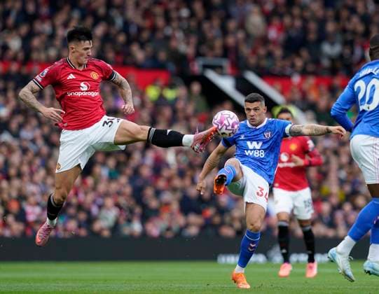 Manchester, England, 4th October 2025. Benjamin Sesko of Manchester United, ManU (L) challenges Granit Xhaka of Sunderland during the Manchester United vs Sunderland Premier League match at Old Trafford, Manchester. Picture credit should read: Andrew Yates Sportimage EDITORIAL USE ONLY. No use with unauthorised audio, video, data, fixture lists, club league logos or live services. Online in-match use limited to 120 images, no video emulation. No use in betting, games or single club league player publications. SPI_001_AY_MAN_UTD_SUN SPI-4195-0001