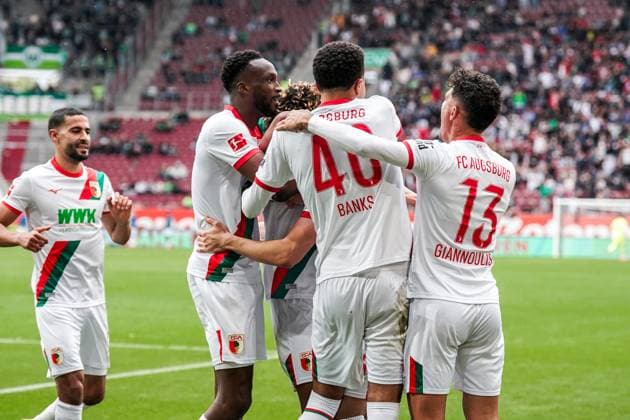 1 Bundesliga 2025 2026 6 Matchday 04 10 2025 FC Augsburg vs VfL Wolfsburg WWK Arena Augsburg, Germany FC Augsburg players cheer after the goal for 2 0 Copyright: xLukaxKolanovicx
