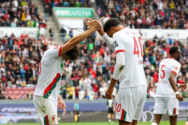 , Goal celebration by Mert Koemuer 36 FC Augsburg , Noahkai Banks 40 FC Augsburg to 2 0 FC Augsburg vs VfL Wolfsburg, Football, 1 Bundesliga, 6 Matchday, 04 10 2025 DFB regulations prohibit any use of photographs as image sequences and or quasi video Augsburg Bayern Germany Copyright: xkolbert-press ChristianxKolbertx