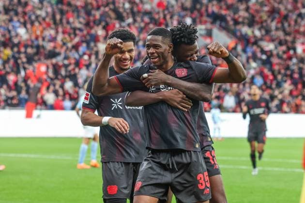 04 10 2025, Soccer, Season 2025 2026, 1 Bundesliga, Matchday 6, Bayer Leverkusen FC Union Berlin, Christian Kofane Bayer Leverkusen celebrates after his goal for 2 to 0 with Edmond Tapsoba Bayer Leverkusen and Malik Tillman Bayer Leverkusen Leverkusen BayArena NRW Germany xRHR PHOTOx Copyright: RHR-FOTOx RHR-FOTO