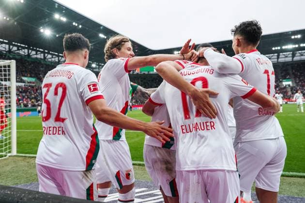 1 Bundesliga 2025 2026 6 Matchday 04 10 2025 FC Augsburg vs VfL Wolfsburg WWK Arena Augsburg, Germany FC Augsburg players cheer after the goal for 3 1 Copyright: xLukaxKolanovicx