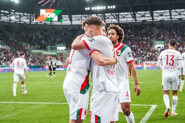 1 Bundesliga 2025 2026 6 Matchday 04 10 2025 FC Augsburg vs VfL Wolfsburg WWK Arena Augsburg, Germany FC Augsburg players cheer after the goal for 3 1 Copyright: xLukaxKolanovicx