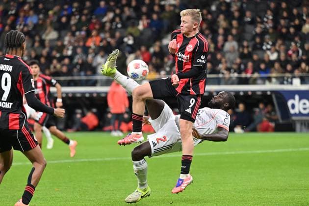 Soccer 1 Bundesliga 6 Matchday Eintracht Frankfurt FC Bayern Munich on 04 10 2025 at Deutsche Bank Park in Frankfurt Dayot Upamecano Munich , below Jonathan Burkardt Frankfurt , above DFL regulations prohibit any use of photographs as image sequences and or quasi video xJKx