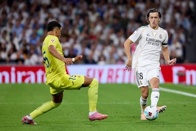 Alvaro Fernandez Carreras of Real Madrid CF and Willy Kambwala of Villarreal CF Real Madrid v Villarreal, La Liga, Football, Estadio Santiago Bernabu, Madrid, Spain - 04 Oct 2025Madrid Estadio Santiago Bernabu Spain EDITORIAL USE ONLY No use with unauthorised audio, video, data, fixture lists, club league logos or live services. Online in-match use limited to 120 images, no video emulation. No use in betting, games or single club league player publications. Copyright: xRubenxAlbarran Shutterstockx 15516230q