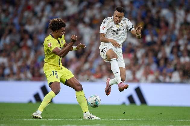 Renato Veiga (Villarreal CF) and Kylian Mbappe (Real Madrid CF) battle for the ball during the LaLiga EA Sports match between Real Madrid v Villarreal CF at Santiago BernabÃ u on October 4, 2025 in Madrid, Spain. (Photo by Manu Reino DeFodi Images) Renato Veiga Villarreal CF and Kylian Mbappe Real Madrid CF battle for the ball during the LaLiga EA Sports match between Real Madrid v Villarreal CF at Santiago BernabÃ u on October 4, 2025 in Madrid, Spain Photo by Manu Reino DeFodi Images