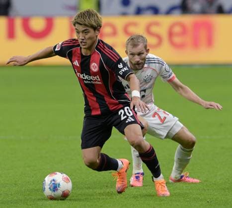 Konrad Laimer hi Against Ritsu Doan photographed at the soccer Bundesliga match Eintracht Frankfurt against FC Bayern Munich on 4 10 2025 in Frankfurt DFL DFB REGULATIONS PROHIBIT ANY USE OF PHOTOGRAPHS as IMAGE SEQUENCES and or QUASI VIDEO