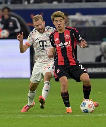 Konrad Laimer left against Ritsu Doan photographed at the soccer Bundesliga match Eintracht Frankfurt against FC Bayern Munich on 4 10 2025 in Frankfurt DFL DFB REGULATIONS PROHIBIT ANY USE OF PHOTOGRAPHS as IMAGE SEQUENCES and or QUASI VIDEO