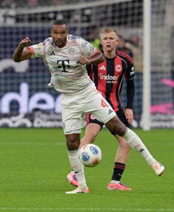 Jonathan Tah against Johny Burkhardt hi photographed at the soccer Bundesliga match Eintracht Frankfurt against FC Bayern Munich on 4 10 2025 in Frankfurt DFL DFB REGULATIONS PROHIBIT ANY USE OF PHOTOGRAPHS as IMAGE SEQUENCES and or QUASI VIDEO