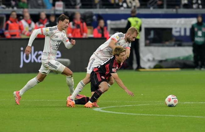 Konrad Laimer hi Against Ritsu Doan photographed at the soccer Bundesliga match Eintracht Frankfurt against FC Bayern Munich on 4 10 2025 in Frankfurt DFL DFB REGULATIONS PROHIBIT ANY USE OF PHOTOGRAPHS as IMAGE SEQUENCES and or QUASI VIDEO