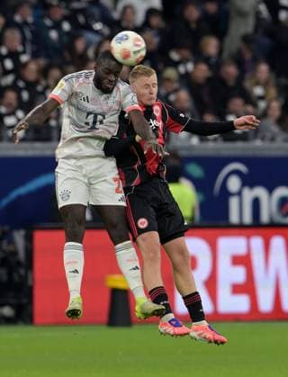 Dayot Upamecano against Johny Burkhardt re photographed at the soccer Bundesliga match Eintracht Frankfurt against FC Bayern Munich on 4 10 2025 in Frankfurt DFL DFB REGULATIONS PROHIBIT ANY USE OF PHOTOGRAPHS as IMAGE SEQUENCES and or QUASI VIDEO