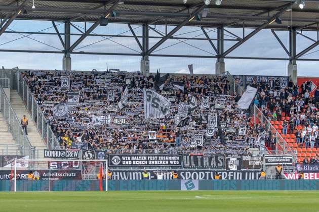 Ingolstadt, Germany 04 October 2025 3 Liga 2025 2026 FC Ingolstadt 04 vs SSV Ulm In the picture The fans of SSV Ulm wave flags and show their scarves DFB regulations prohibit any use of photographs as image sequences and or quasi video Audi Sportpark Bayern Copyright: xFotostandx xSchäferx