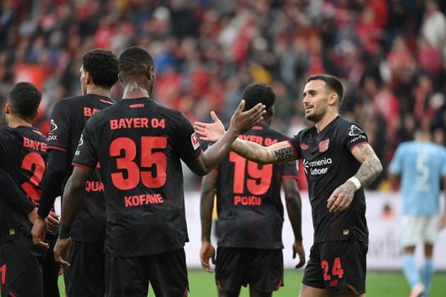 Cheers Aleix Garcia Bayer 04 Leverkusen , Christian Kofane Bayer 04 Leverkusen , v re 04 10 2025, Soccer 1 Bundesliga, Season 2025 2026, 6 Matchday, Bayer 04 Leverkusen Union Berlin 2 0 DFL regulations prohibit any use of photographs as image sequences and or quasi video Leverkusen BayArena Nordrhein Westfalen Germany Team2