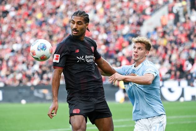 Loic Bade Bayer 04 Leverkusen , Loïc BadÃ , li , against Andras Schäfer Union Berlin 04 10 2025, Soccer 1 Bundesliga, Season 2025 2026, 6 Matchday, Bayer 04 Leverkusen Union Berlin 2 0 DFL regulations prohibit any use of photographs as image sequences and or quasi video Leverkusen BayArena Nordrhein Westfalen Germany Team2